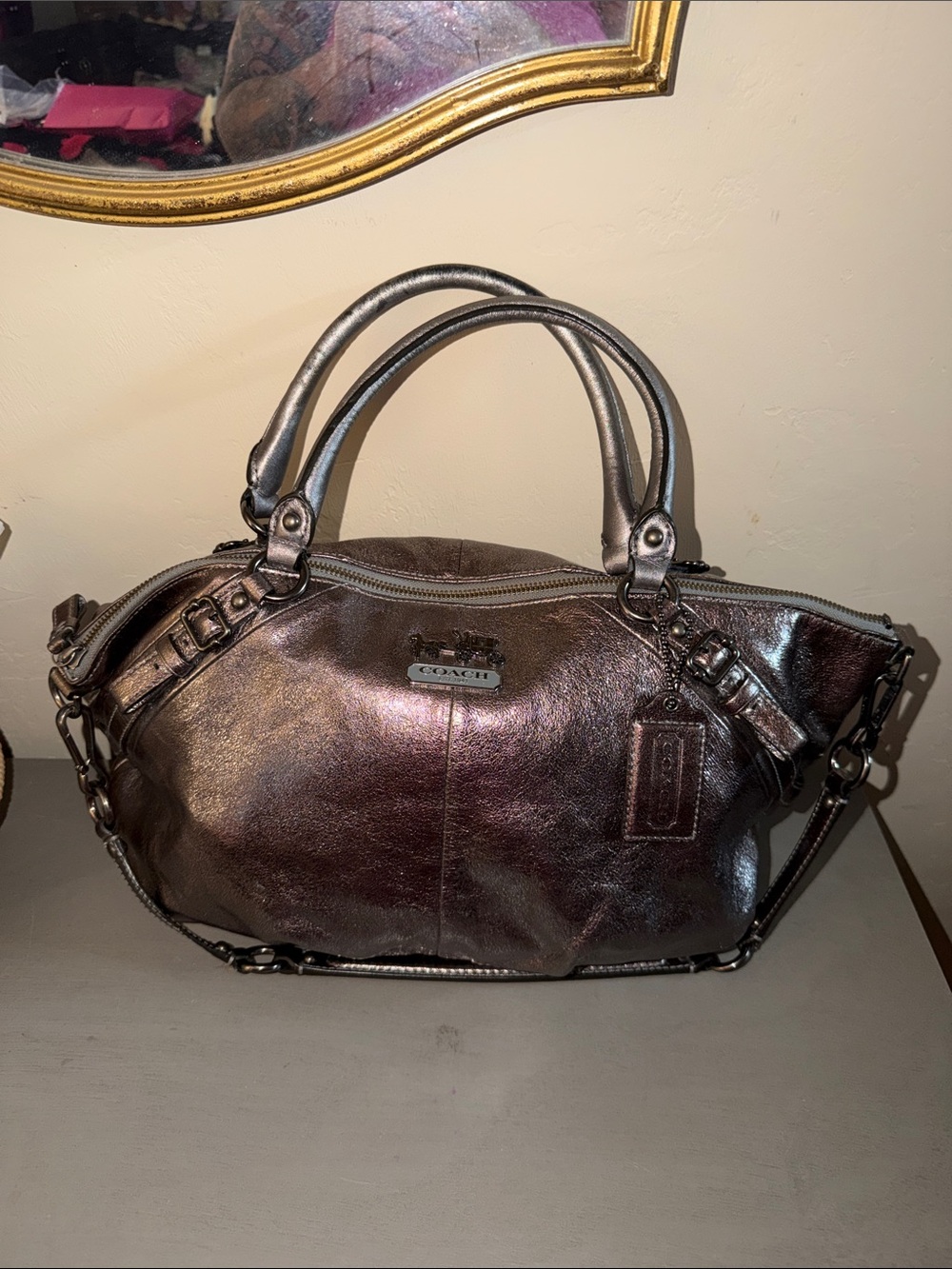 This Coach Madison Sophia satchel is crafted from pleated metallic
